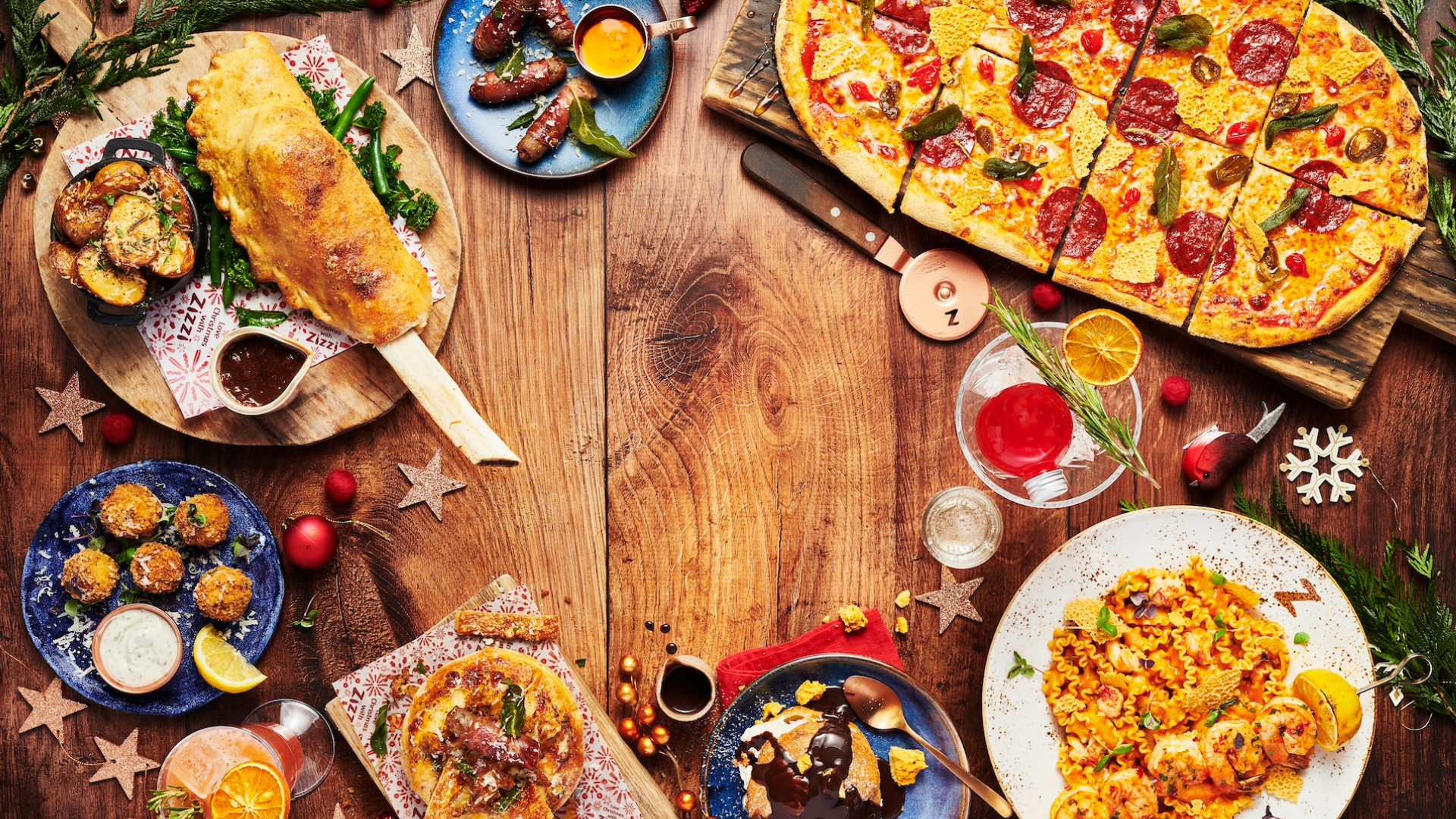 Christmas food spread with pizza, pasta and festive specials